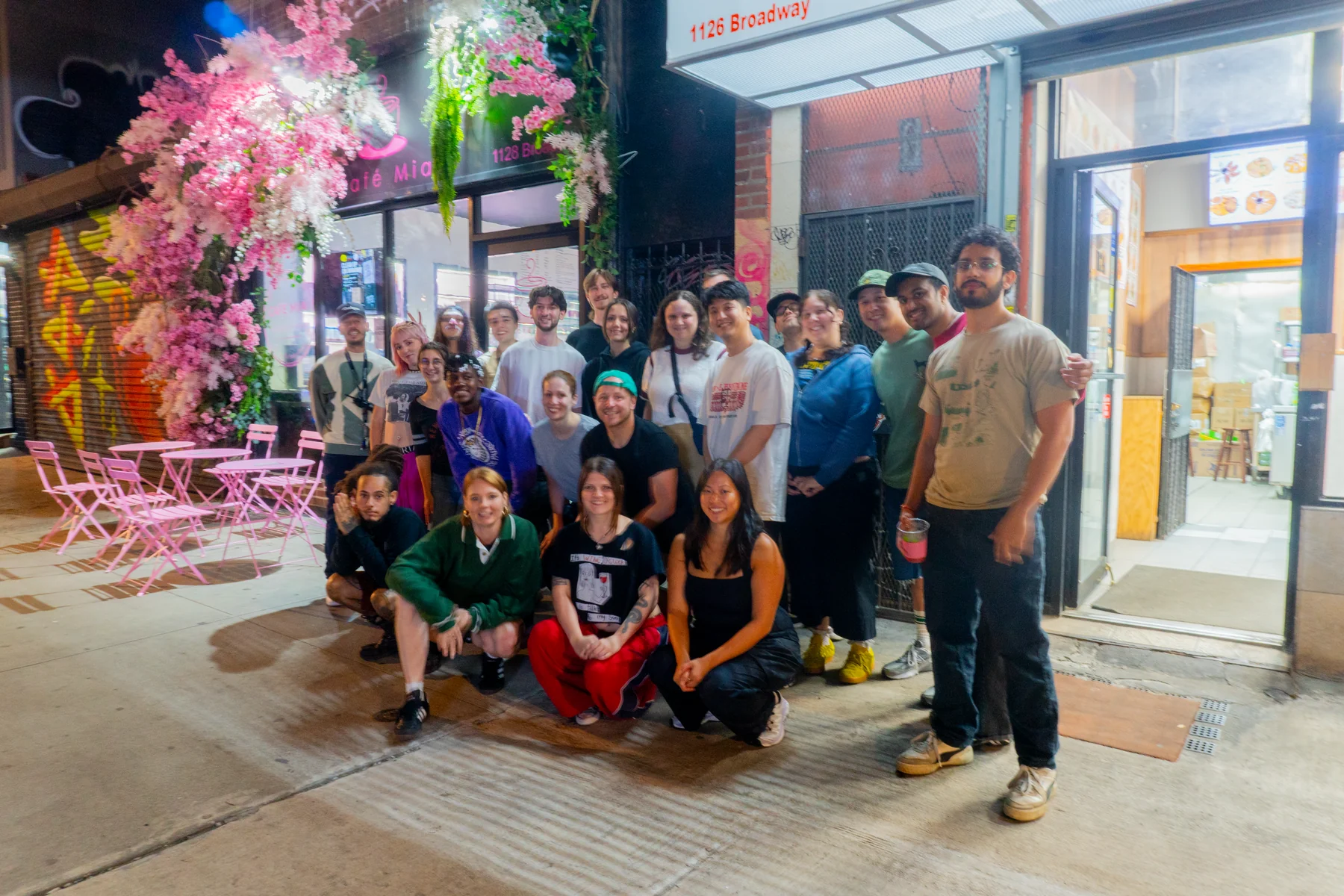 Community Hits Different — group of 30+ Bushwick neighbors in front of Café Mia after cleaning up the block with Stashmaster and Bushwick Trash Lady